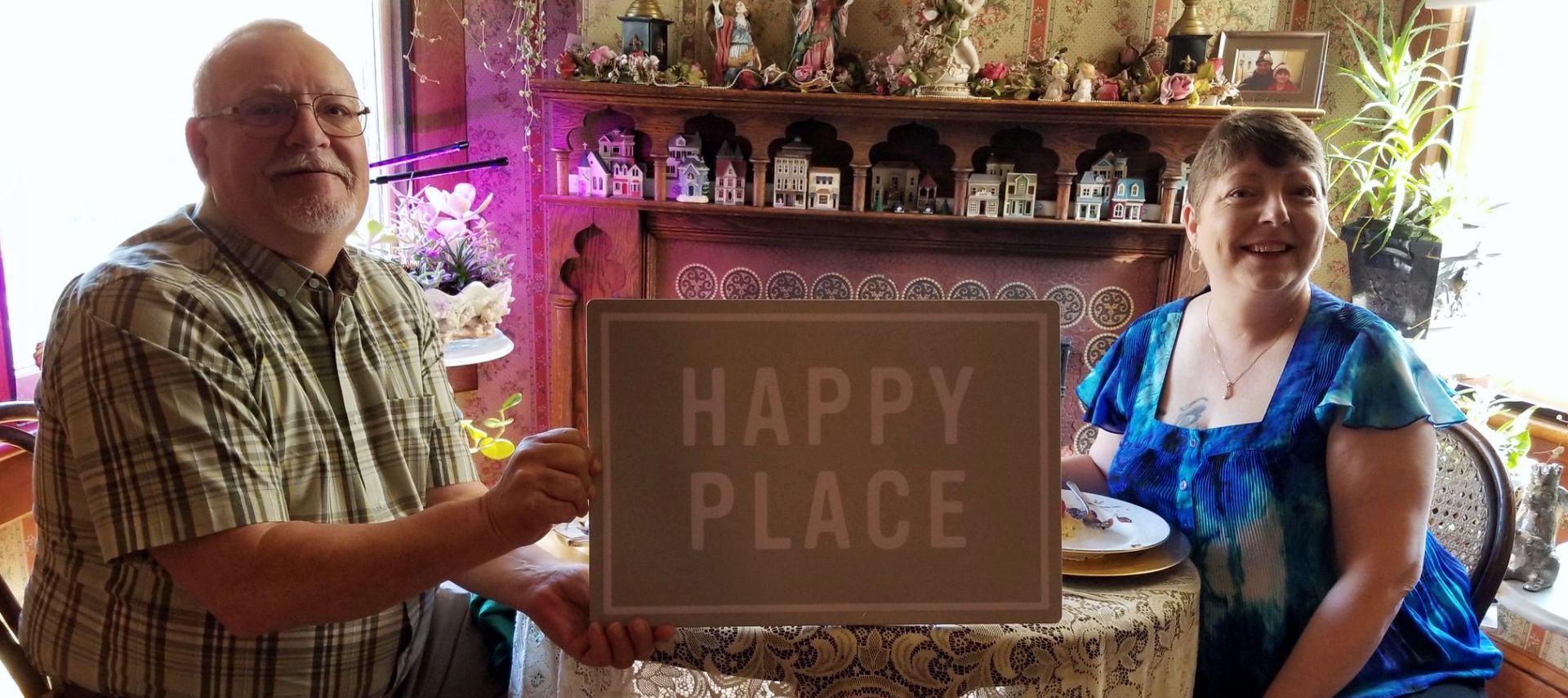 Guests at The Queen, A Victorian Bed and Breakfast | Bellefonte, PA. Breakfast at the romance table, Happy Place sign.